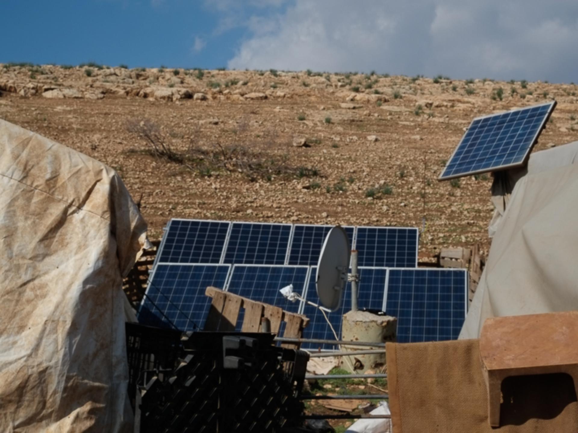 Solar energy panels in the shepherds encampment in the Jordan Valley