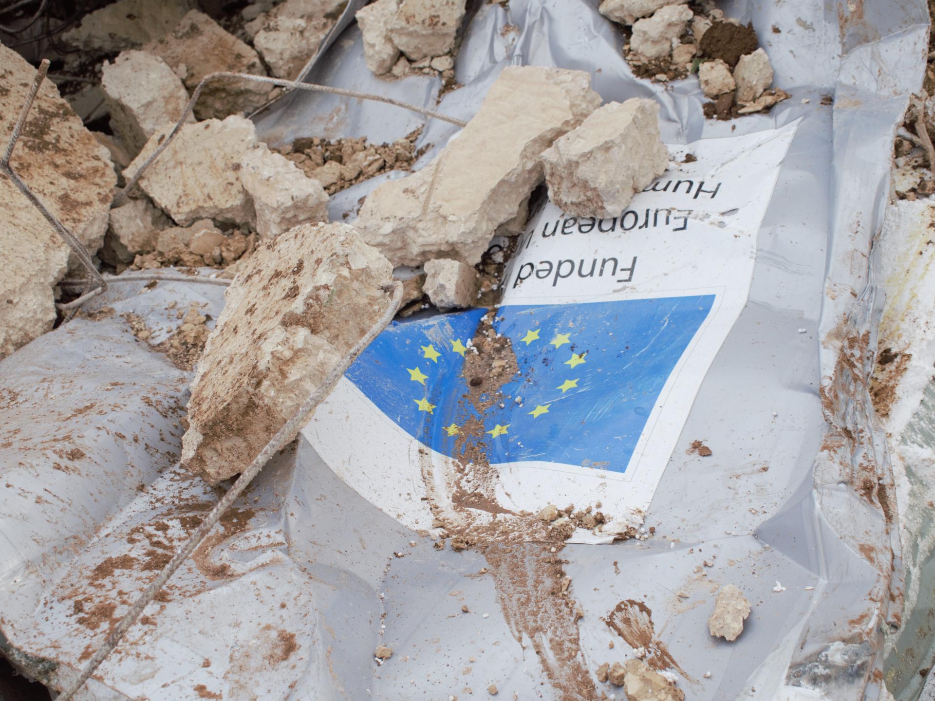 The demolished caravan at Furush Beit Dajan, with the plaque identifying it as a donation by the European Union