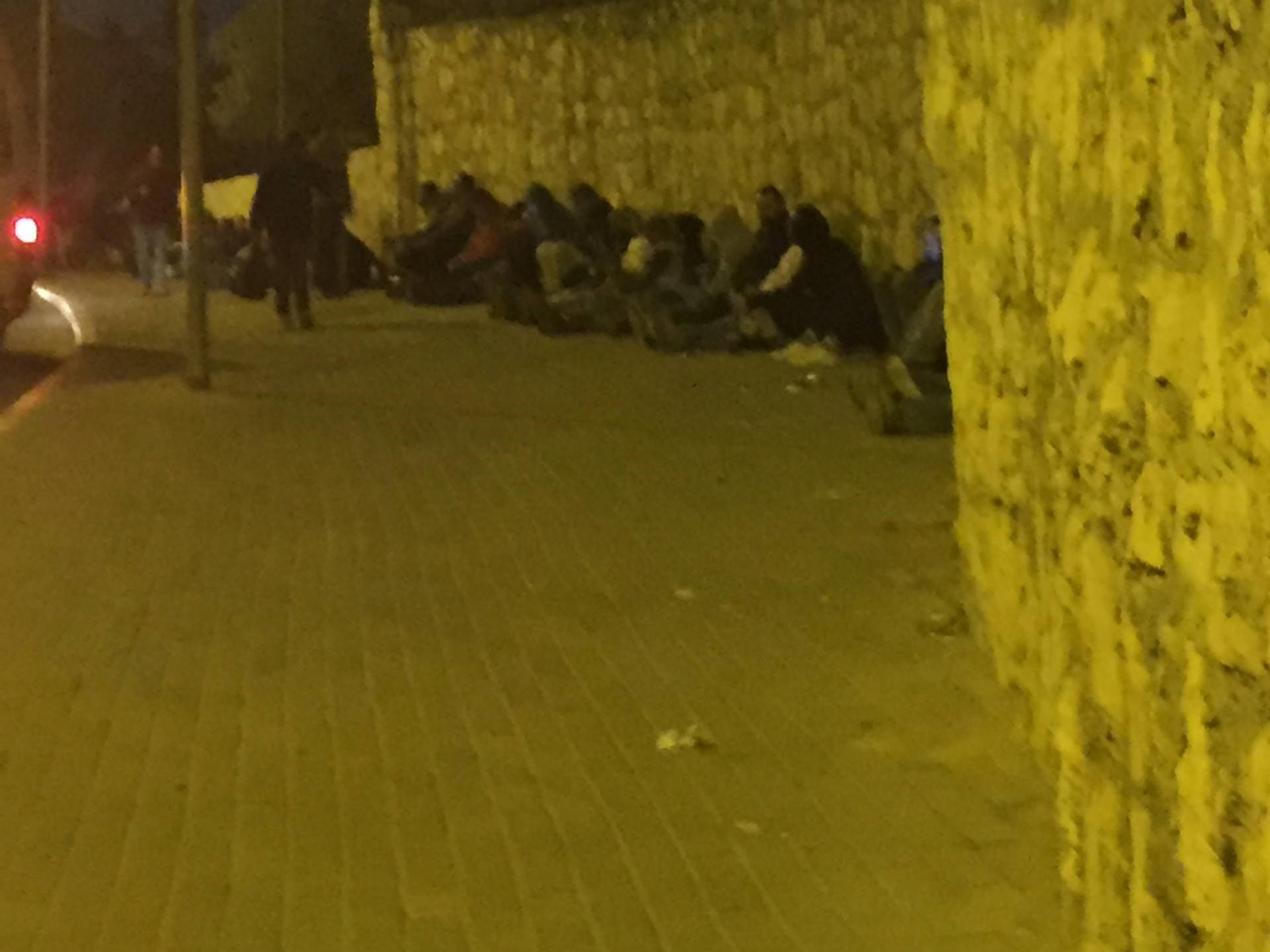 And at  5.15 the pavements were already full of men sleeping or sitting quietly