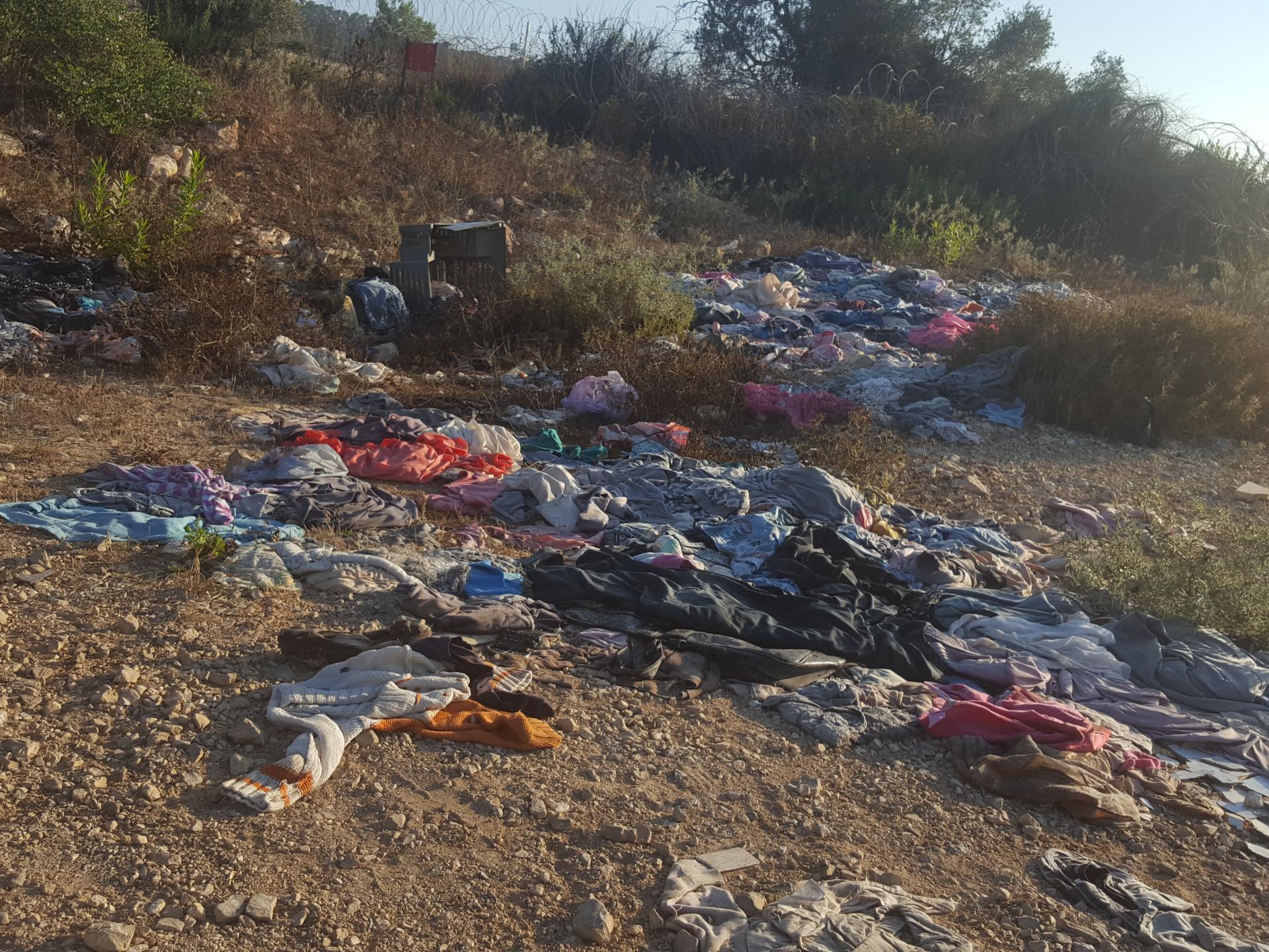 ​‘Aneen Checkpoint 11.7.18 – Clothes (that we gave to people) thrown at the olive grove near to the checkpoint