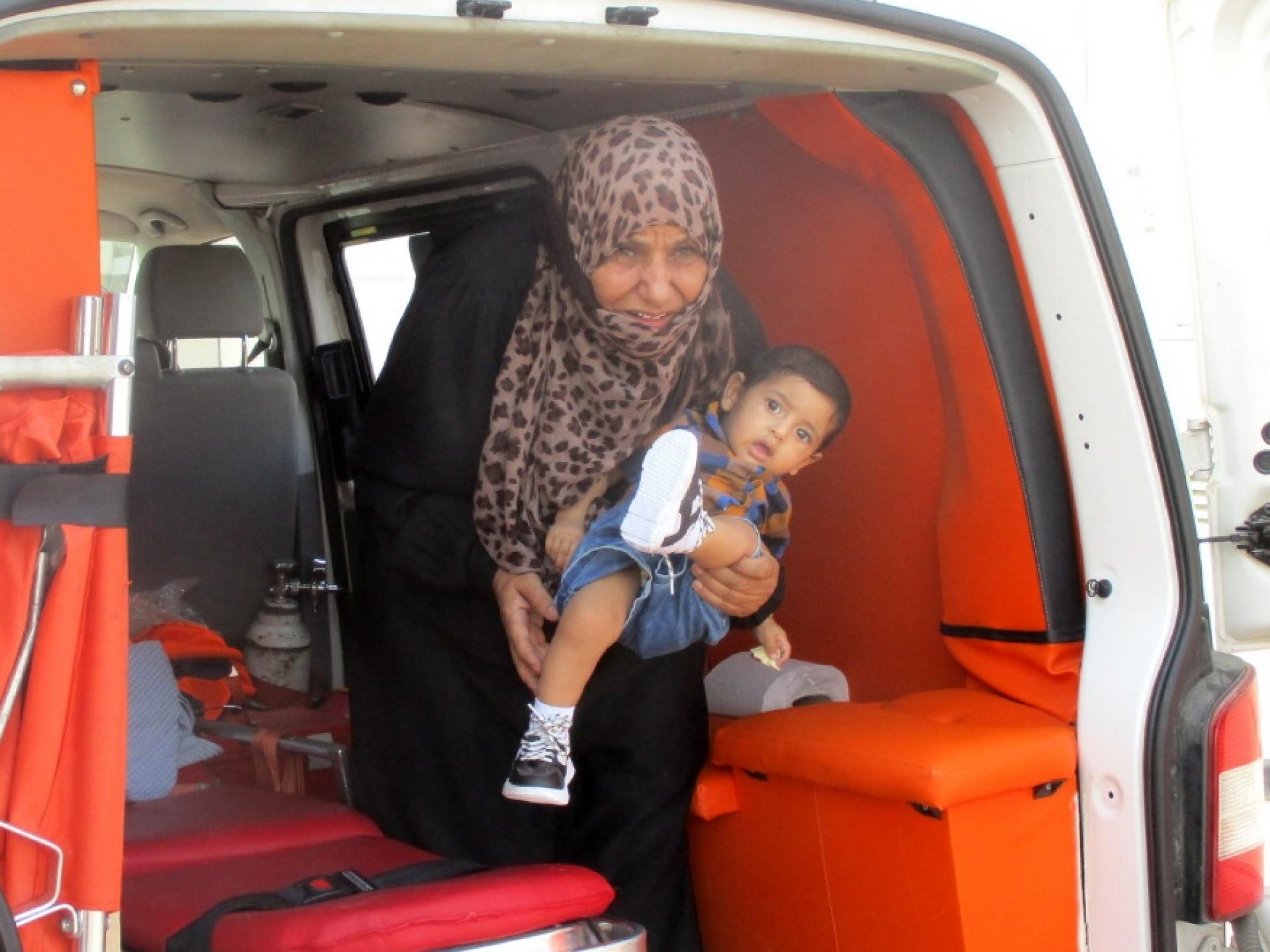 The two-year old child was passed to his mother's arms in the Jerusalem ambulance