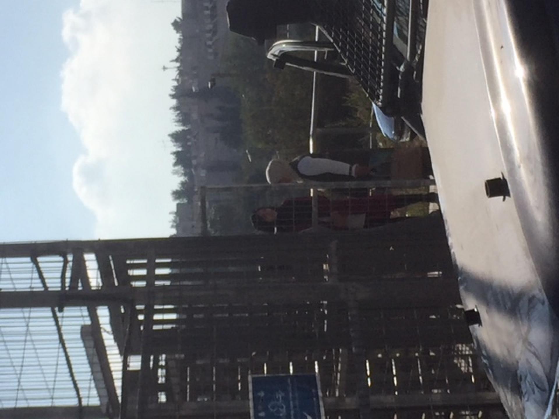 Woman crossing the gate to Kafisha neighbourhood