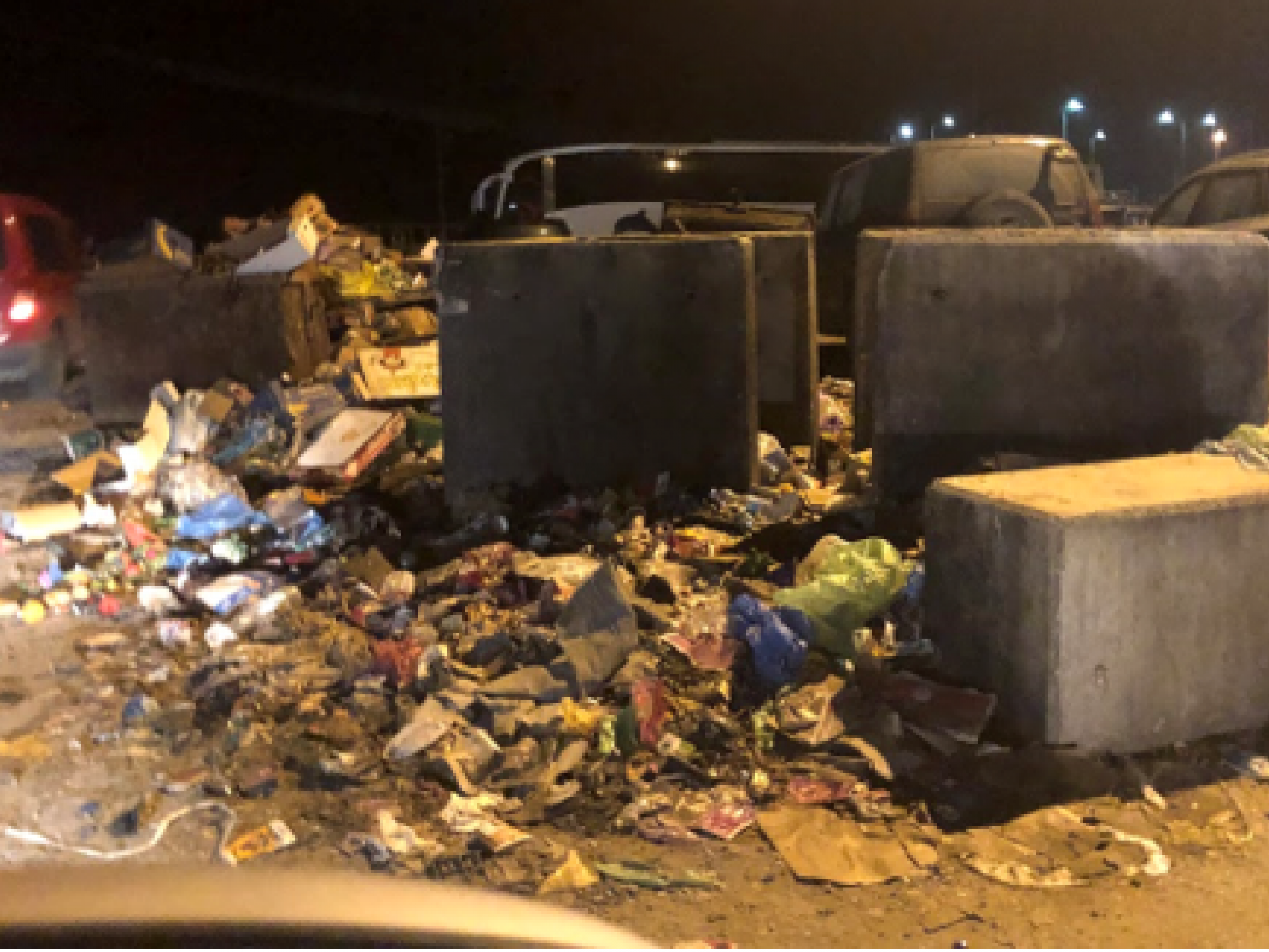 The piles of waste at the entrance to the Tarqumiya car park