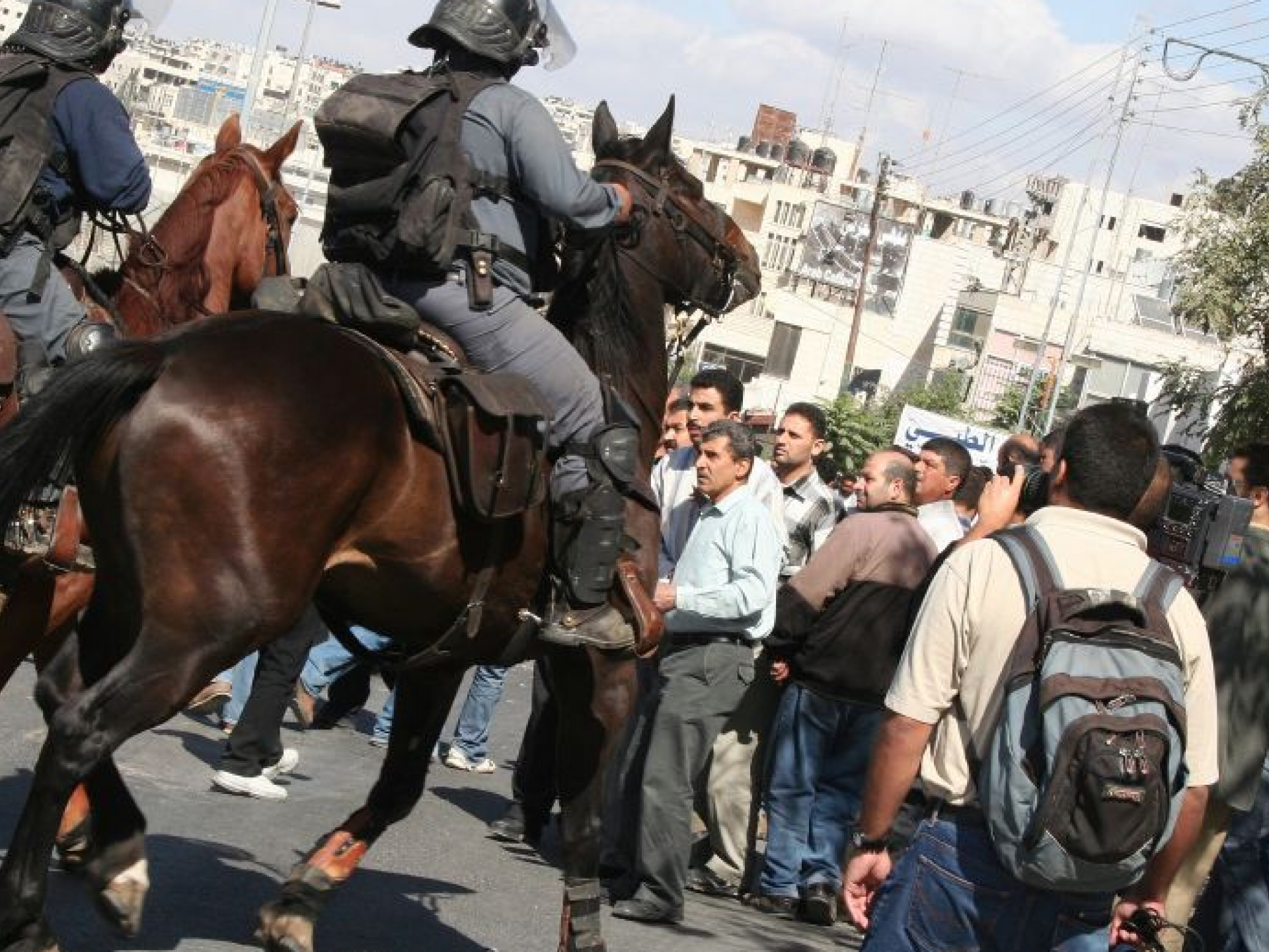 Mounted Policemen Controlling the Passage of Civilians