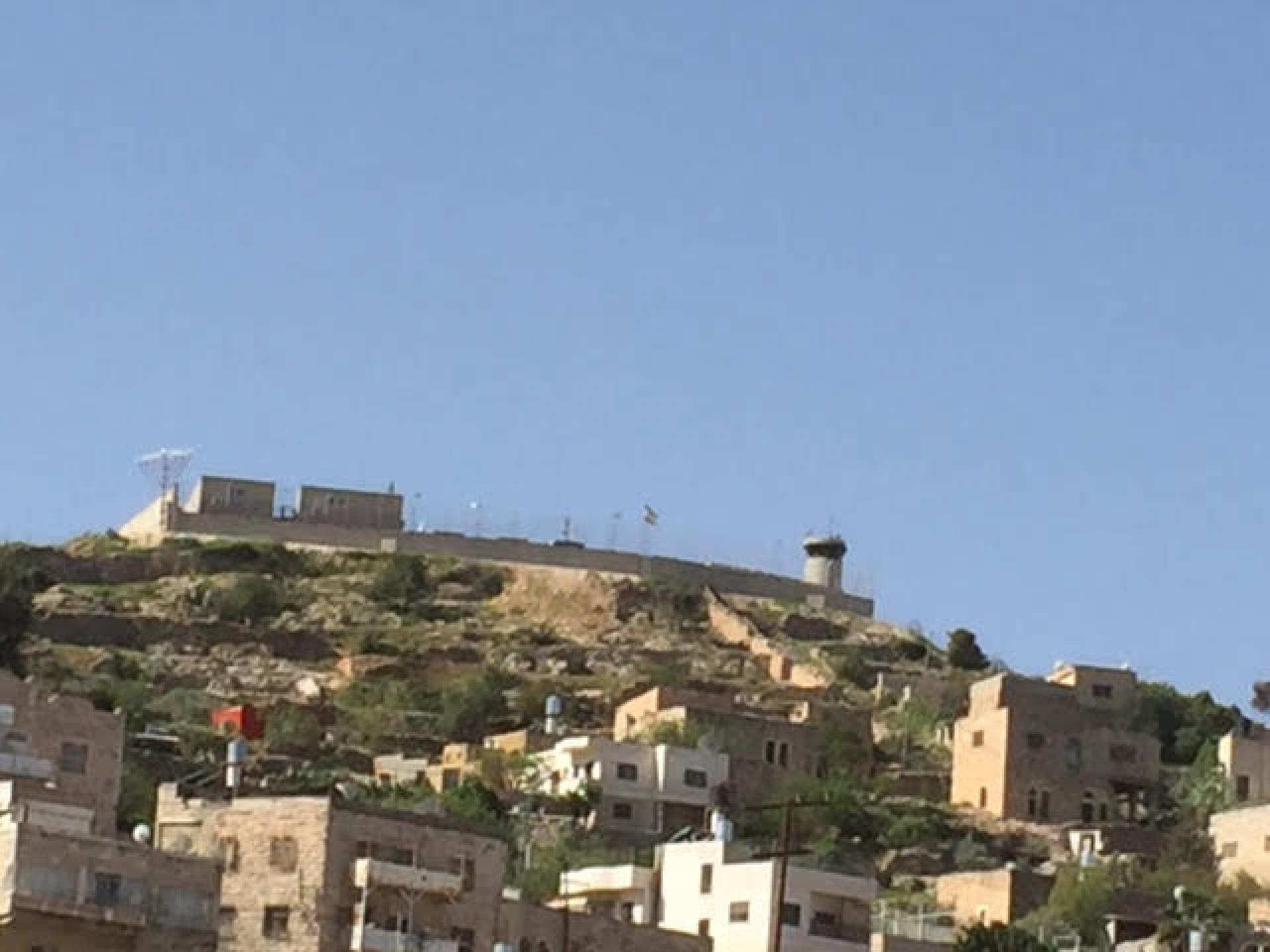 The pillbox above the Abu Snan neighborhood with the base built around it. Photographed from Gross Square
