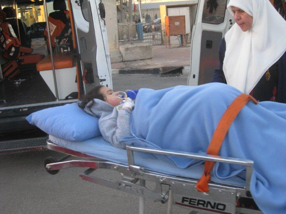 Back to back ambulance transfer.  Ambulances from the West Bank are forbidden to enter Israel.  Photo for illustration only.