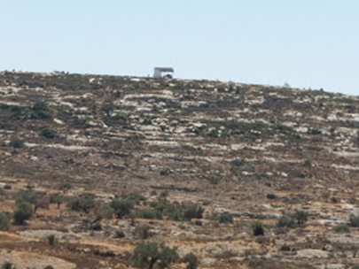On the hilltop, in a single structure with solar panels and a water tanker, live hill-youths who come down to harass Palestinians when they come to work in the olive groves