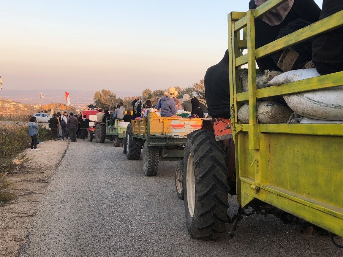 Aanin checkpoint: returning from a day of work in the olive  harvest.