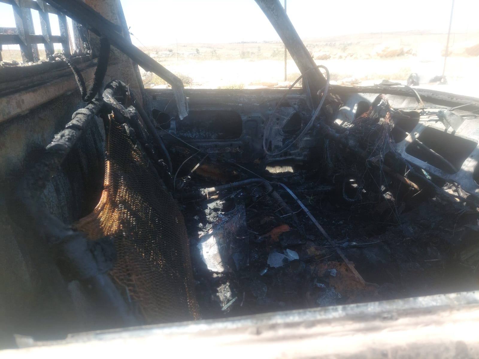 Umm Darit - the burnt car
