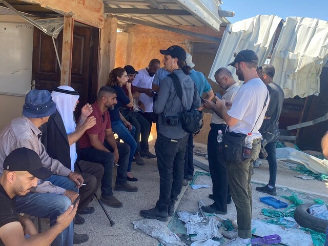 Gathering again at the destroyed school in Zenota