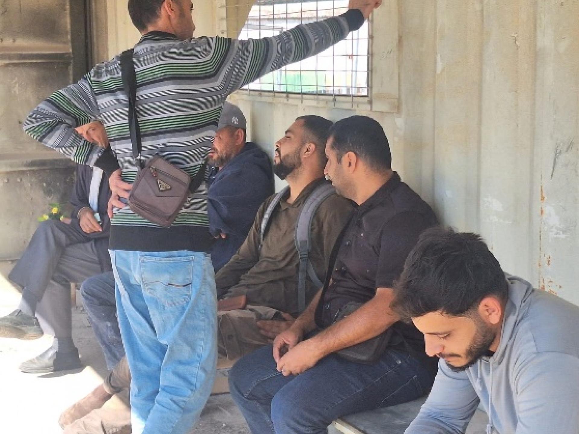 Habla: Young men from Ras a-Tira are waiting for the gate to open