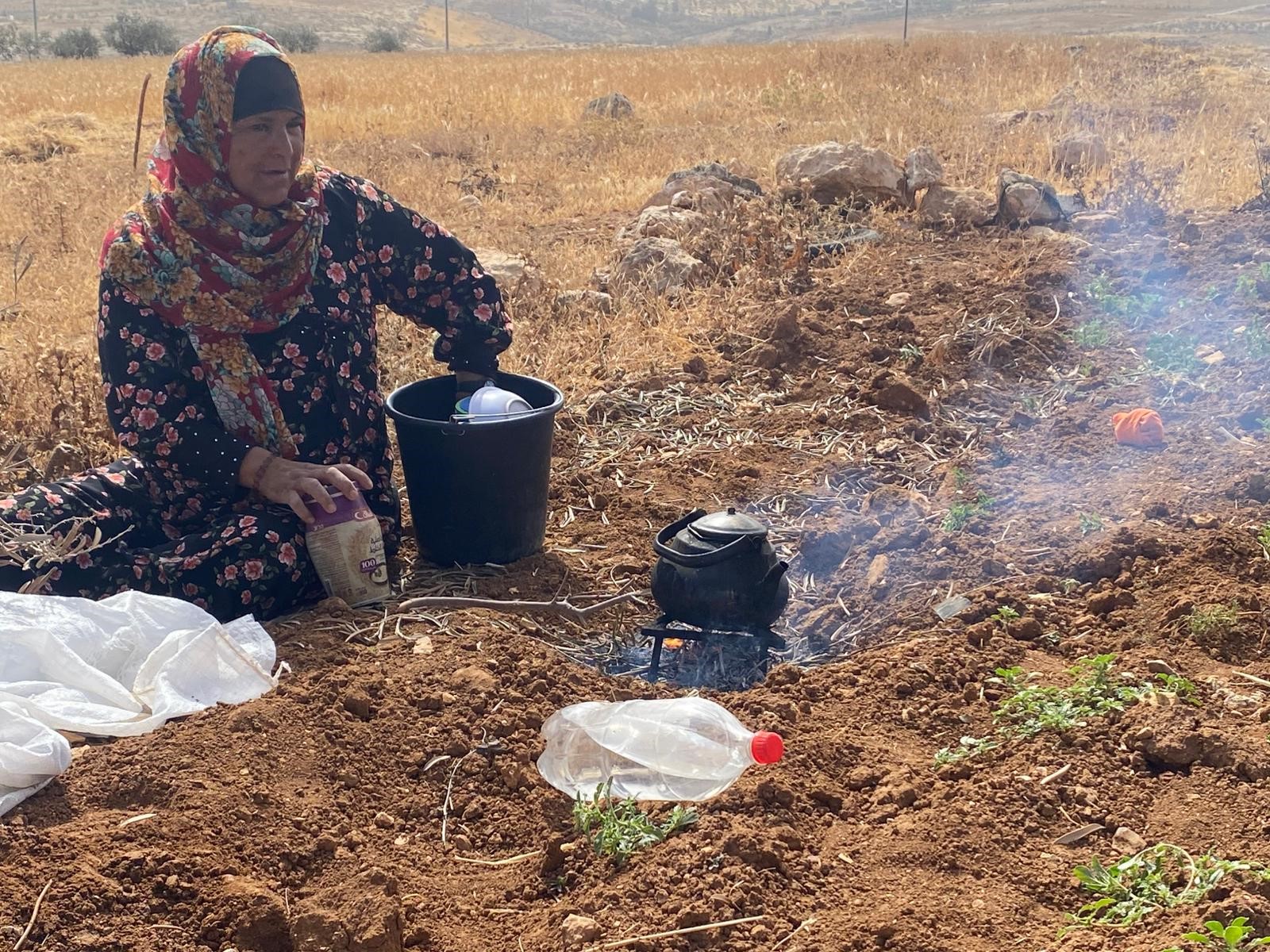 In the fields of Umm Faqra, tea is made over charcoal.