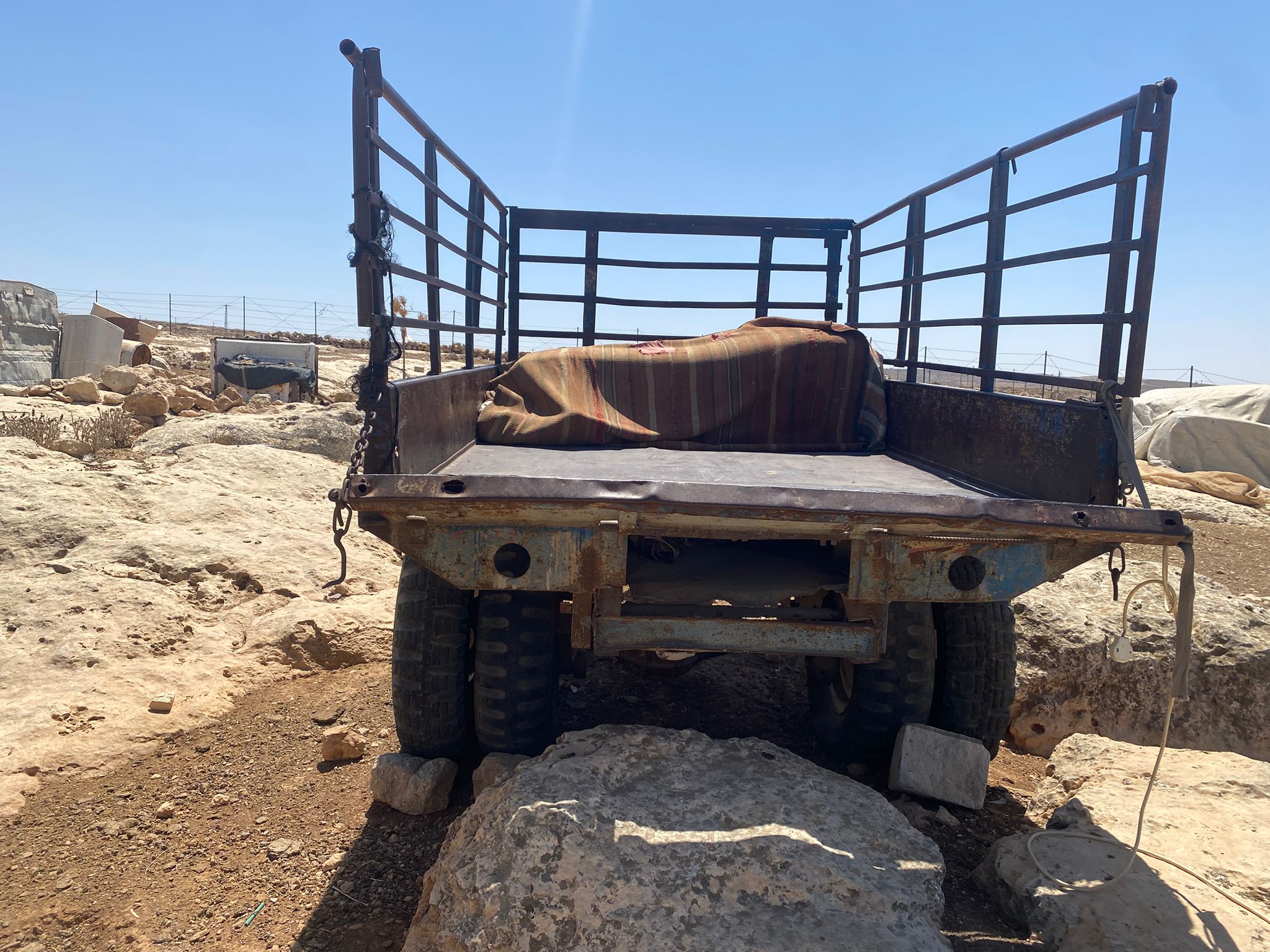 Susiya - This is the cart that Ahmad and Halima sleep on at night, afraid to be in their shack lest it be set on fire by the settlers.