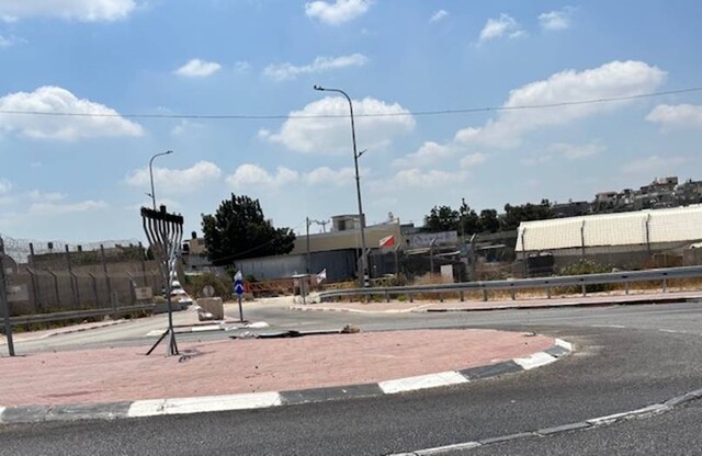 Azzun: Enclosed by a high fence and the gate to the village is closed