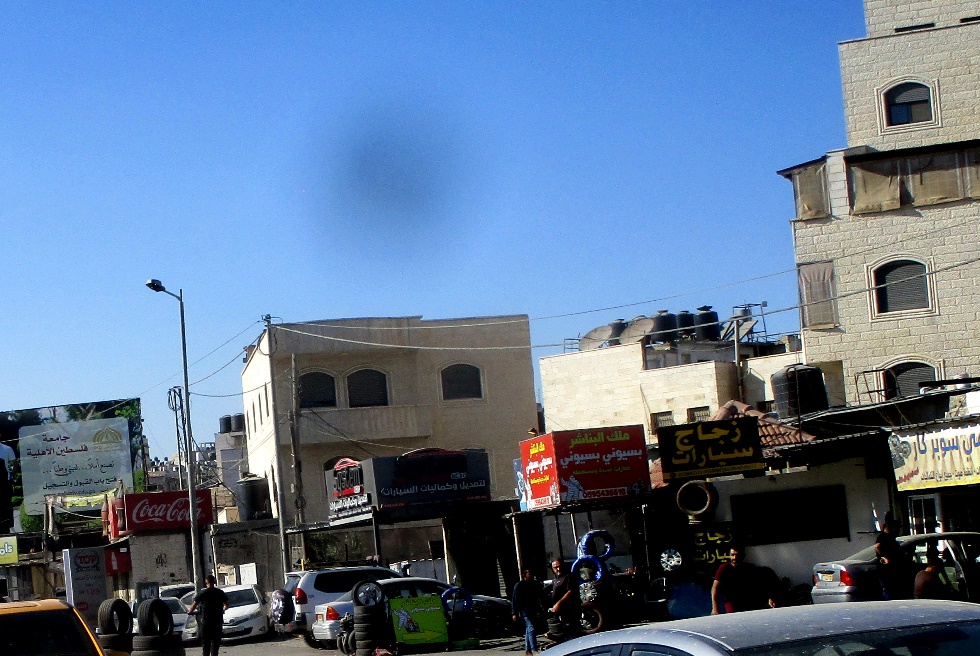 Qalandiya: black cloud hovering over the refugee camp roof tops