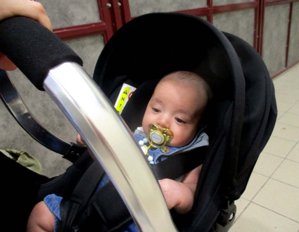 Qalandiya: Baby in a stroller before crossing the checkpoint