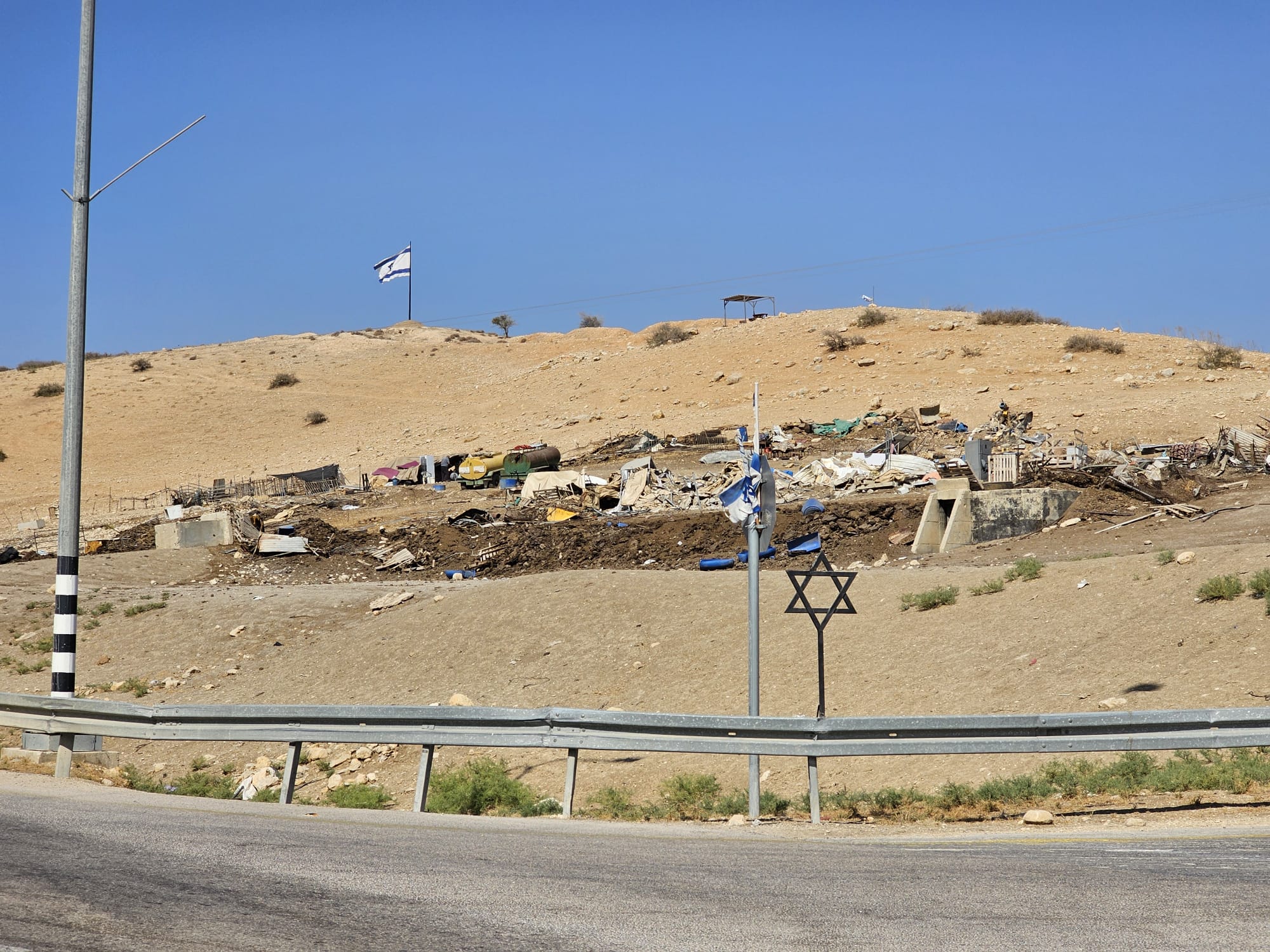 Ein Al-Hilwe: Star of David, Israeli flag and a ruined family compound