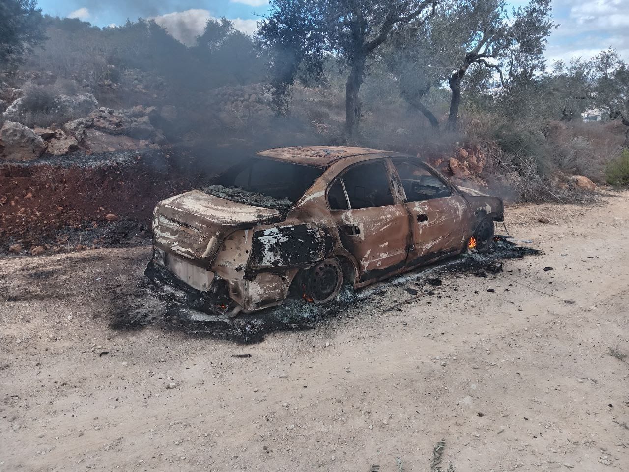 Beta: One of the cars burned by the settlers 