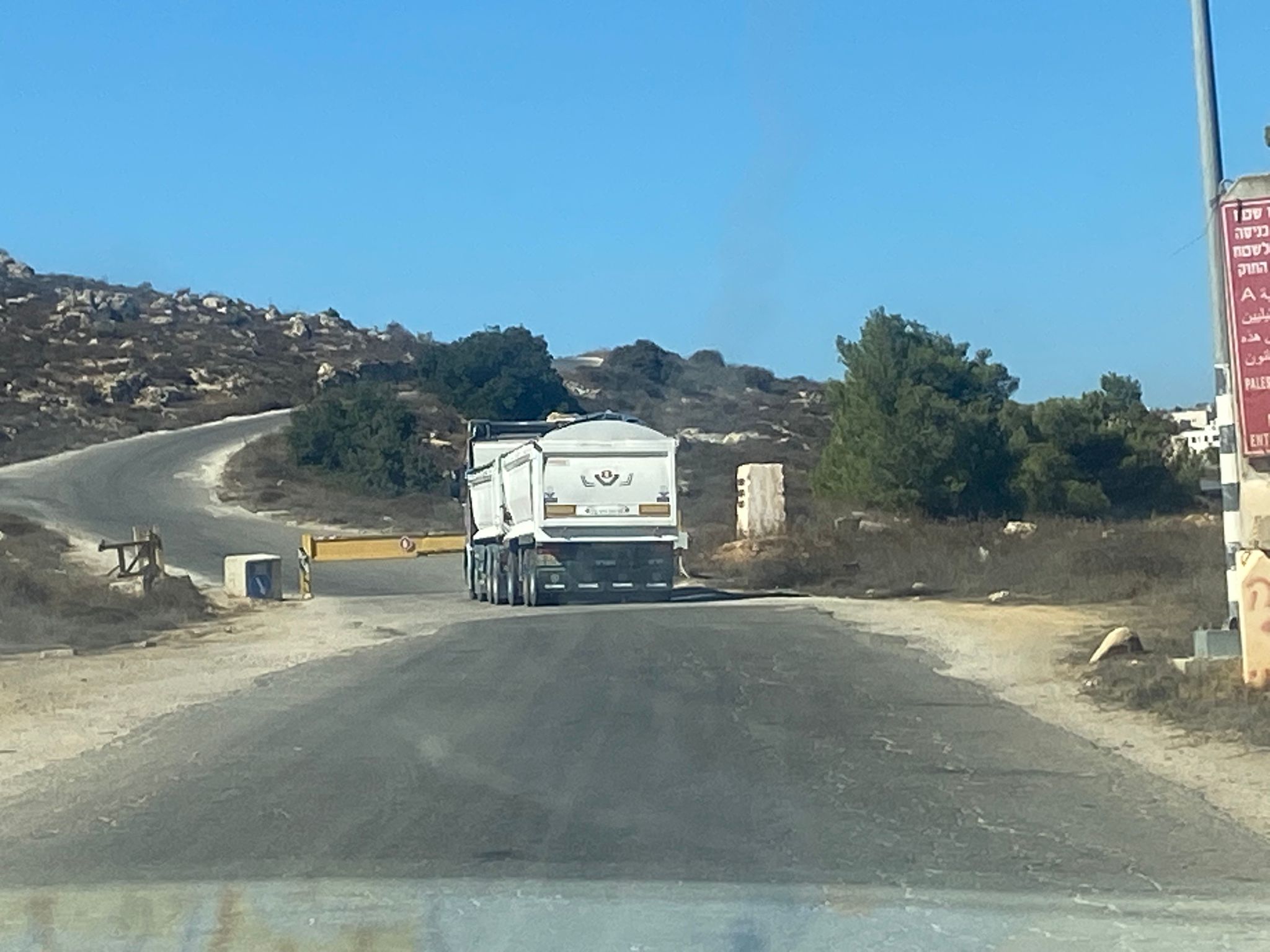 At the checkpoint towards Khursa, only settlers are allowed to pass; they have a key and they open and close the checkpoint.
