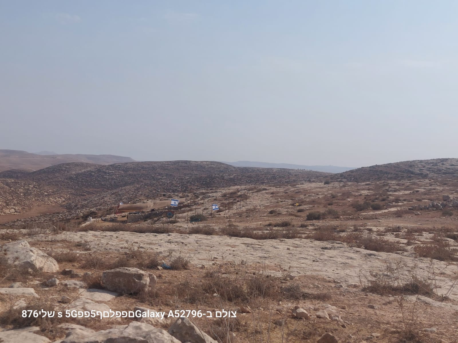 Debauched - Israeli flags mark the territory that is being planned to take from the family