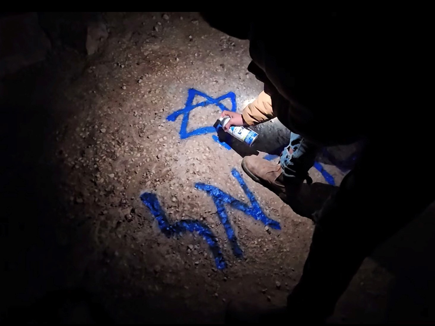 Samra: Settlers spray around the well opening