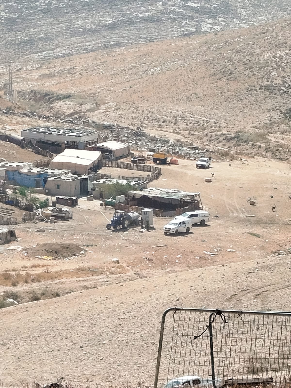 2 - 2 vans with the tractor and water tank