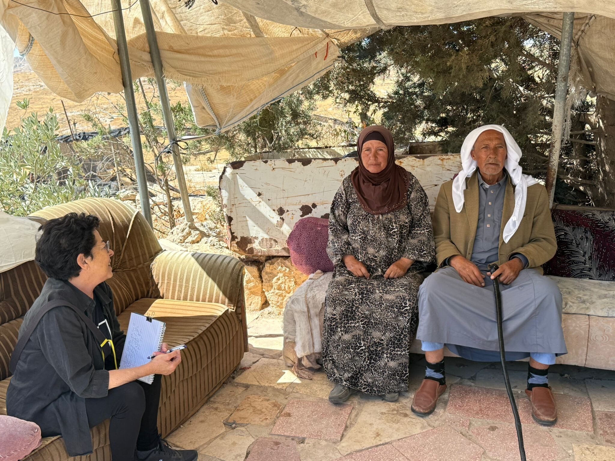 Daphna in the yard with Najah and Muhammad in Susiya