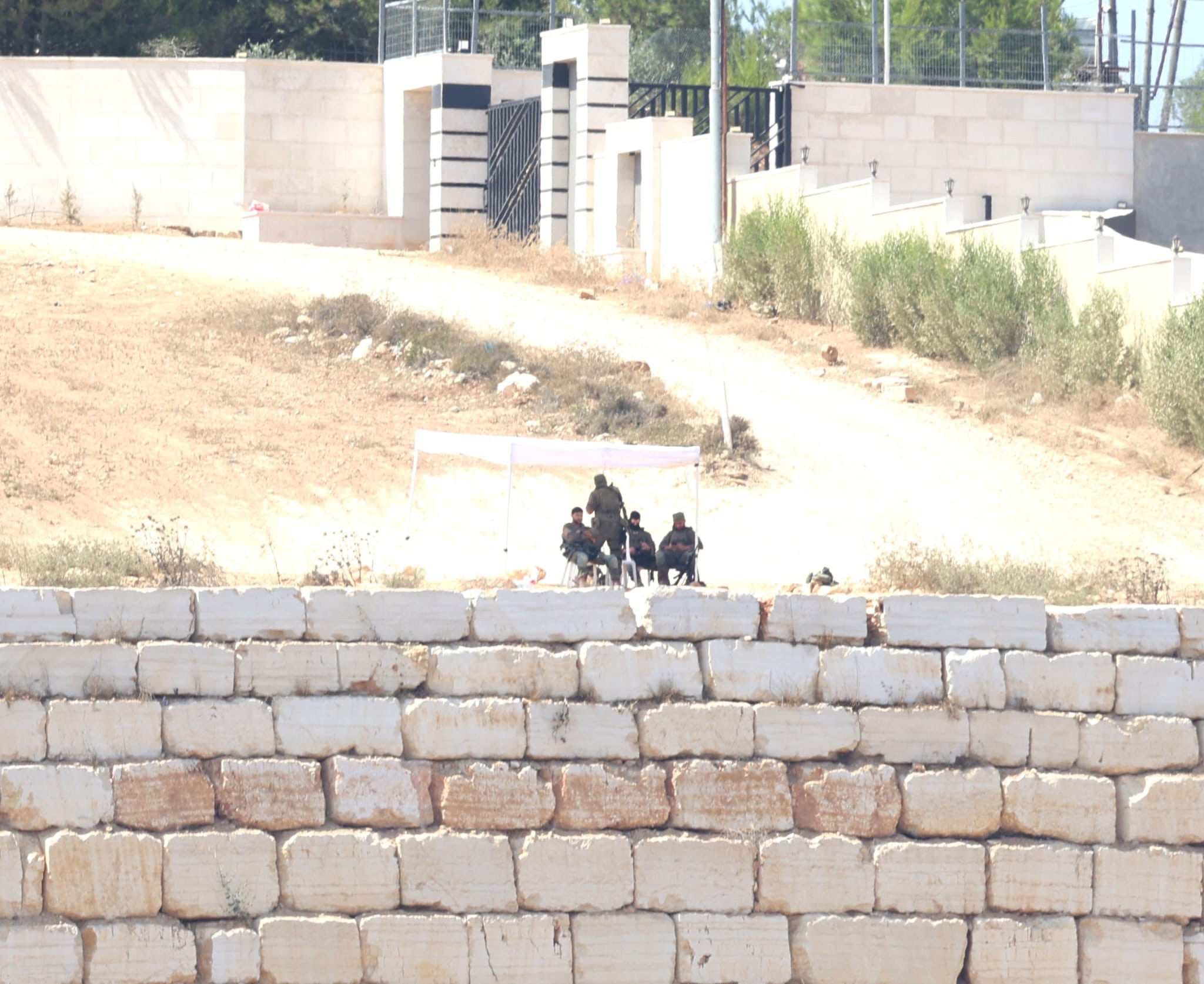 Qusra: Soldiers watching the house under siege