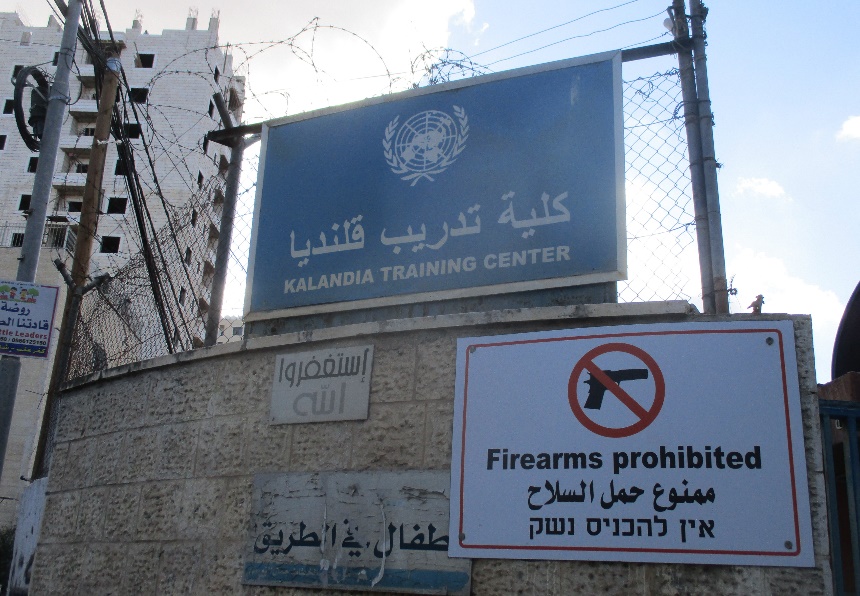 Kfar Aqab (Jerusalem). Signs on the fence at the UNRWA compound