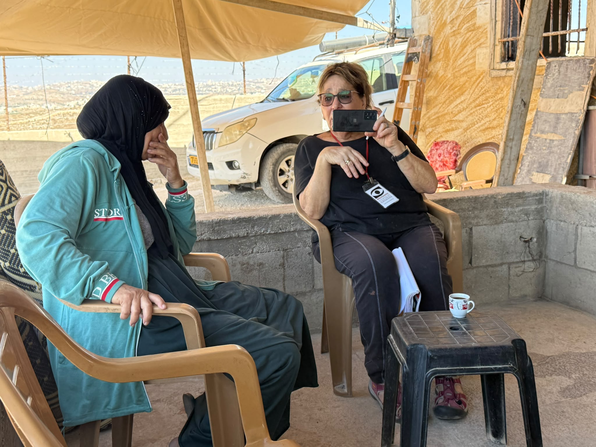 Michal with Alia Nawaja'a in Khalet al-Fara'a in her burned-down house