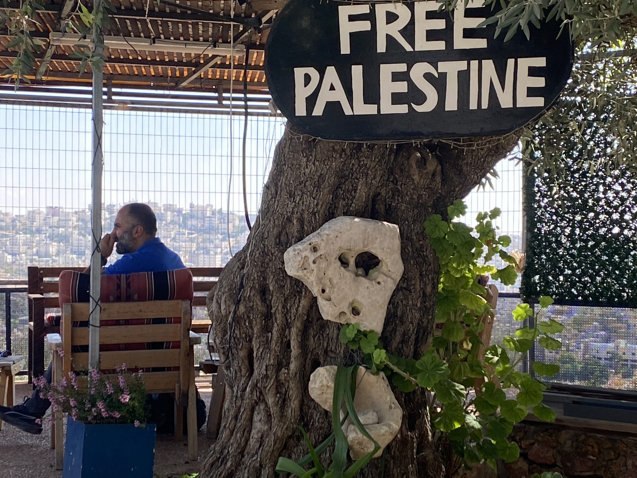 Issa looks out over Hebron from his fortified home