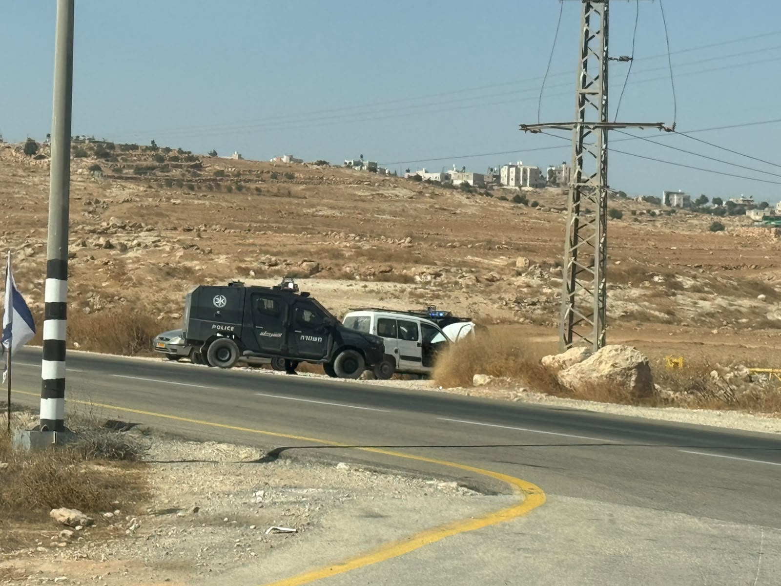 The vehicles were stopped by two police jeeps, in front of Tuwani
