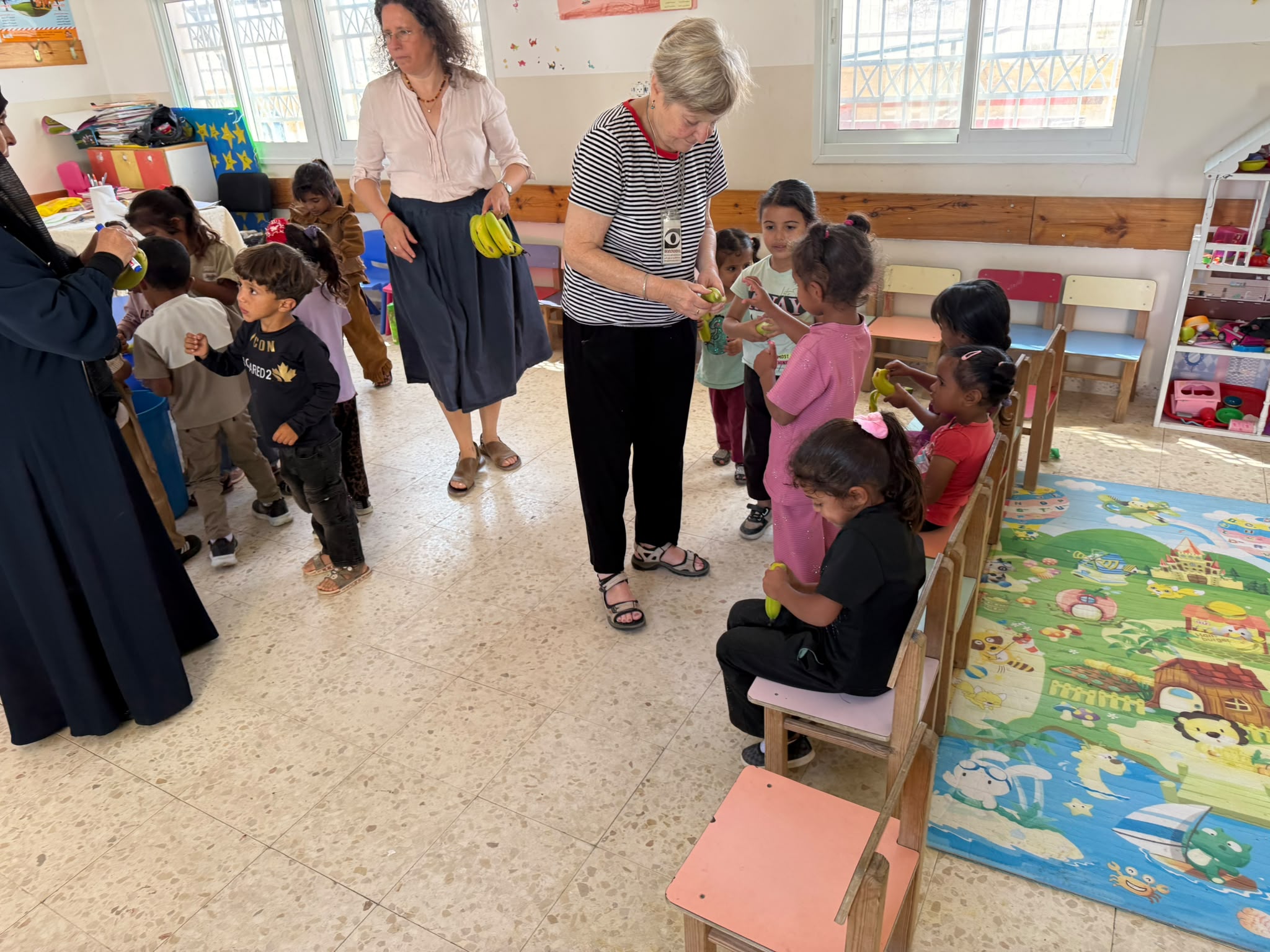 Smadar with the children in Huda's kindergarten. Khashem a-Daraj